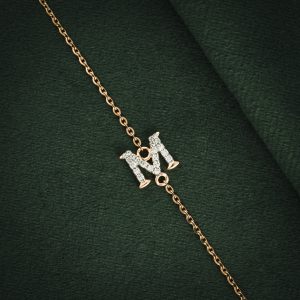 DIAMOND-ENCRUSTED "M" GOLD BRACELET